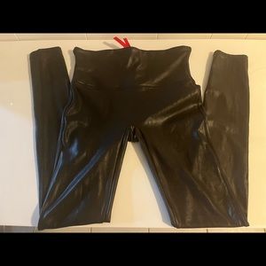 2 pants Spanx WoW Faux Leggings & 7 For All Mankind Black Faux Leggings.